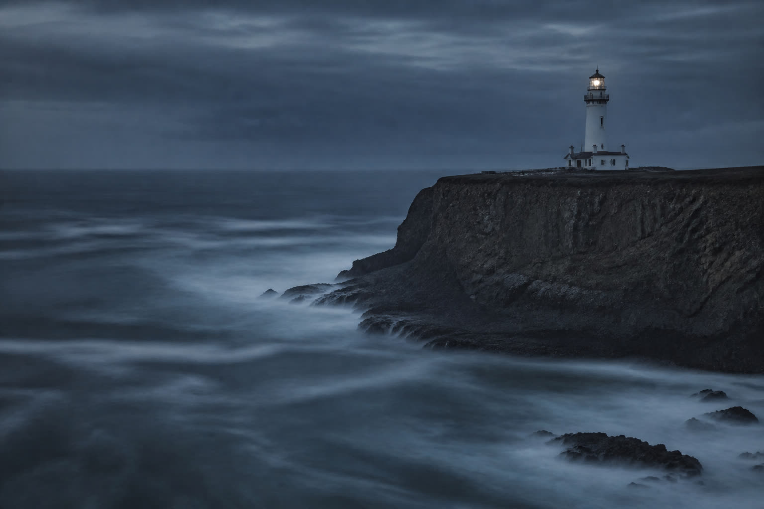 AI-generated lighthouse emerging through cinematic ocean fog